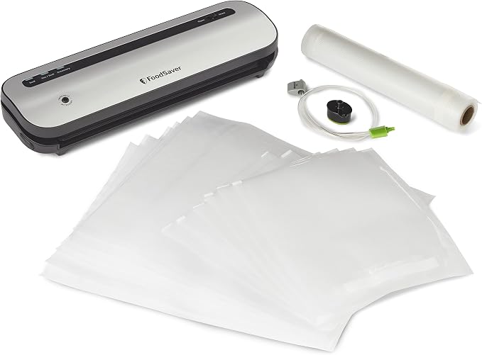 Silver FoodSaver Space-Saving vacuum sealer with roll, bags and accessory components